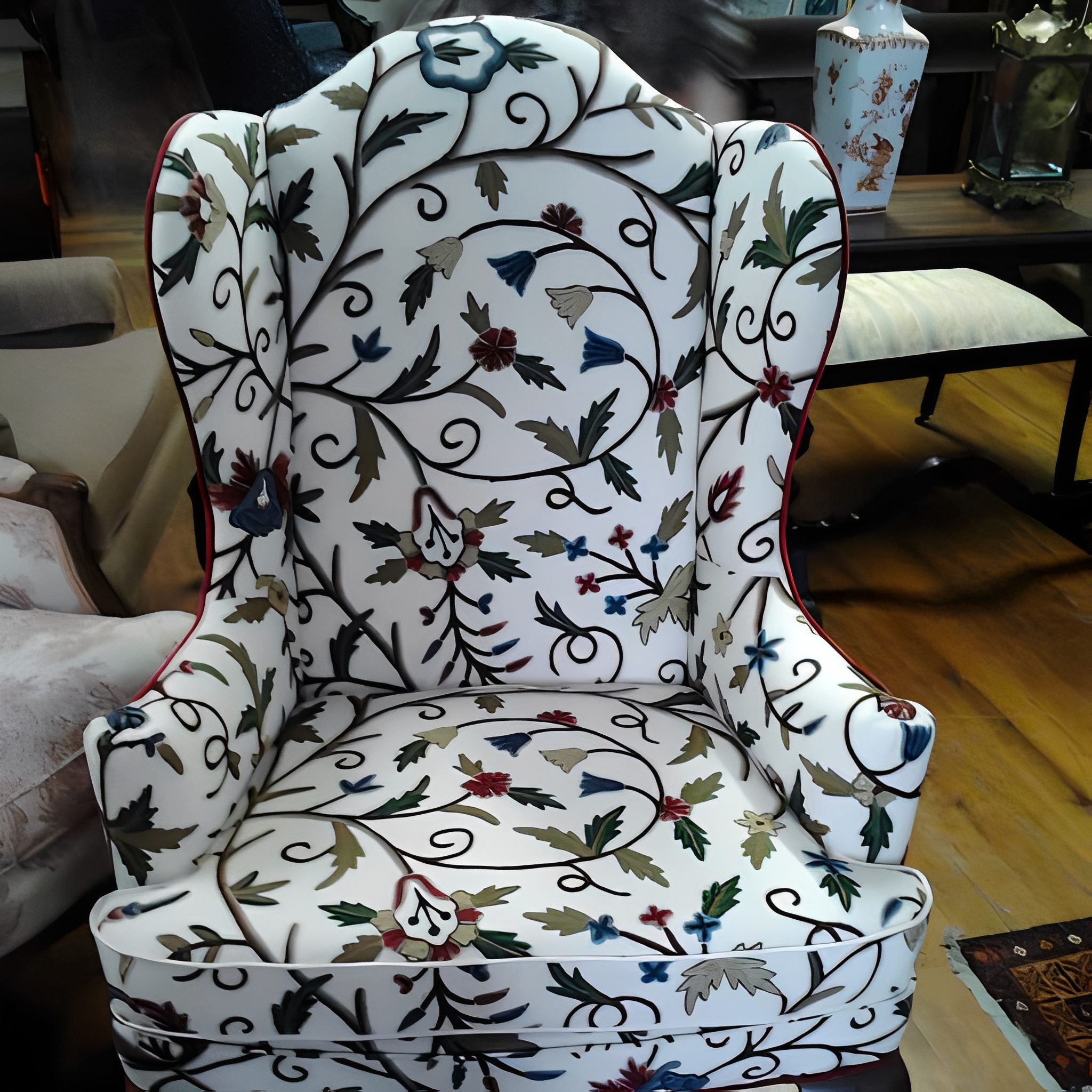 Floral patterned wingback chair in room.